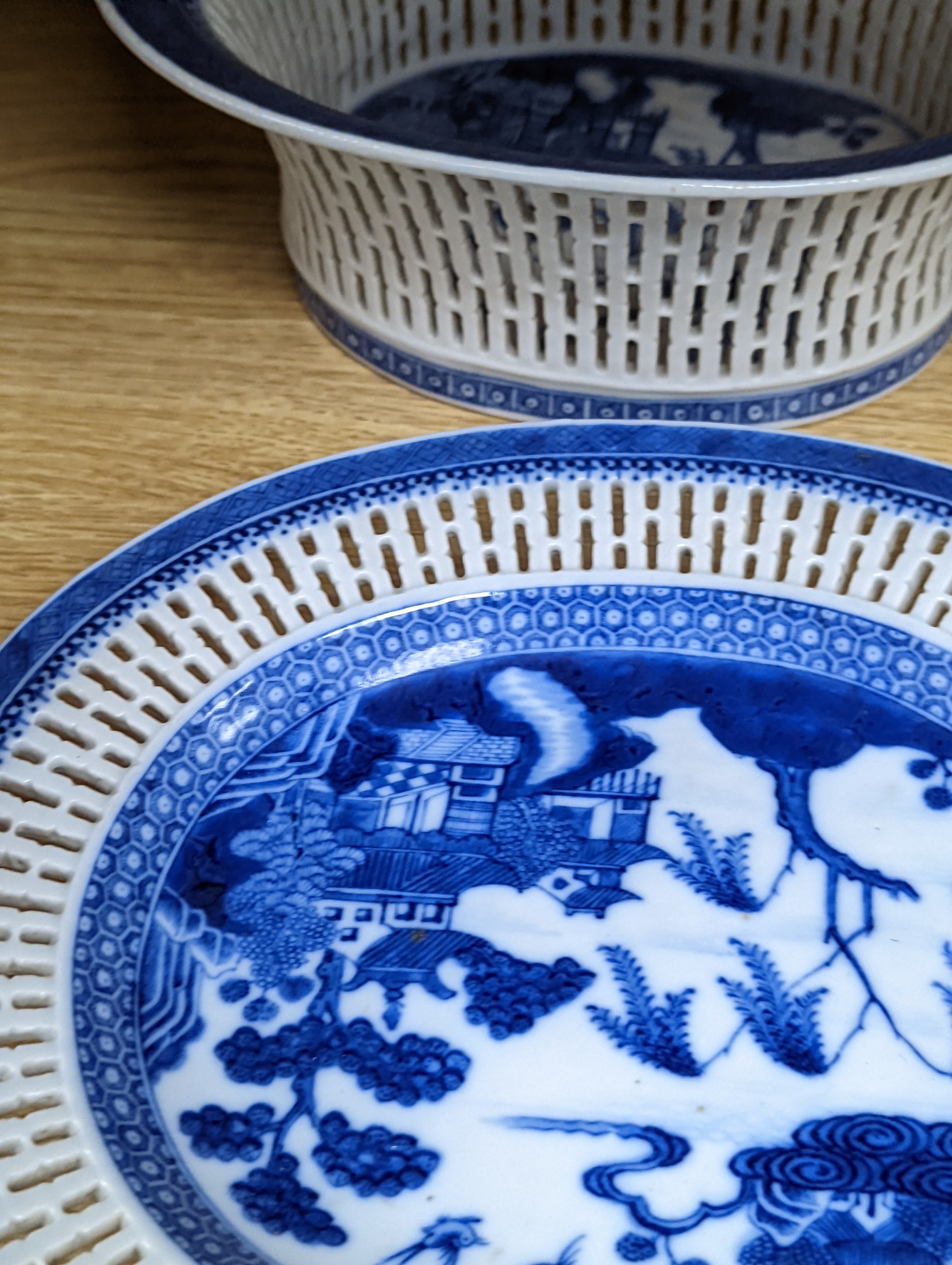 A Chinese blue and white chestnut basket and stand, Qianlong period, basket 11 cms high.